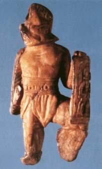 Bone figurine of a gladiator (a murmillo) from Lexden. From Khne, E. + Ewigleben, C. (2000) 'Gladiators and Caesars' BMP: London