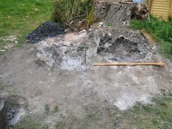9. The excavated ash pits (scale is a metre rule).
