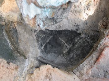 23. The partly exposed hearth.
