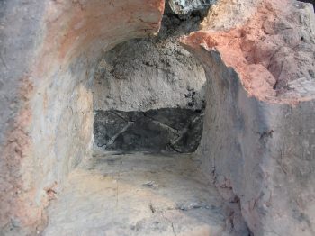 21. View down stoke hole showing hearth and section through ash.