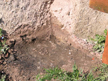 15. Detail showing the build up of material at the base of the furnace wall (opposite view in Photograph 3.