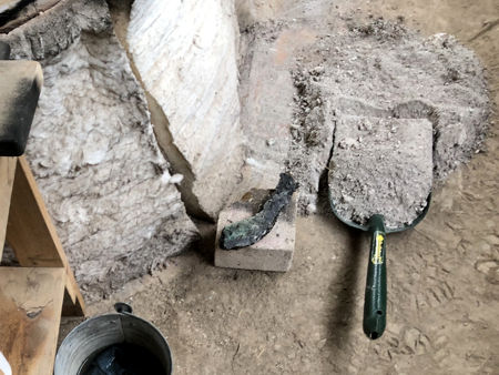 Light grey ash from Day Two, together with a lump of debris (Photo © Fiona Rashleigh)