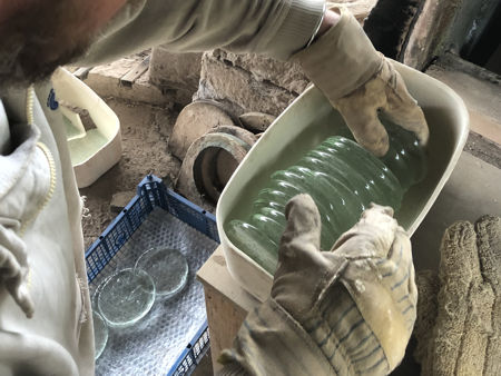 Filling a replacement pot with glass 'cakes' (Photo © Fiona Rashleigh)