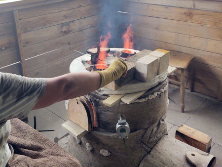 Beadmaking, with the furnace at about 1100°C